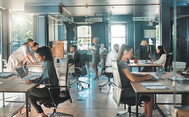 A busy professional office team at work